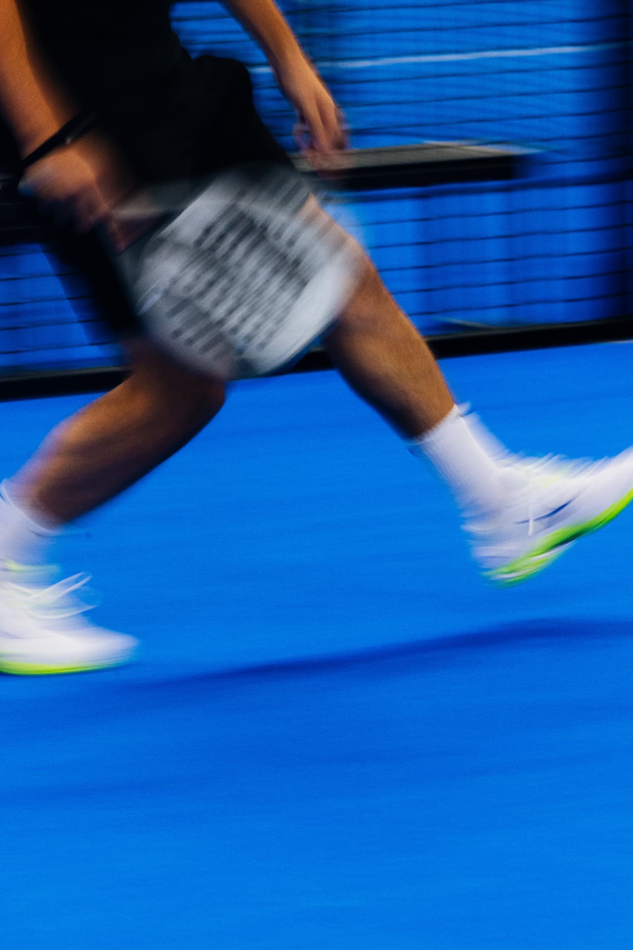 Padel footwork captured in motion blur