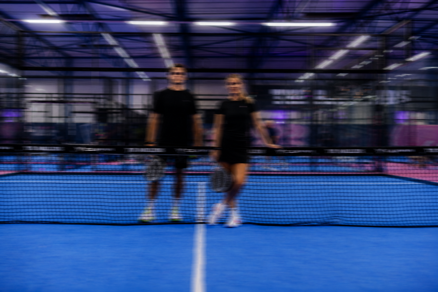 Players at the net at The Padellers Breda